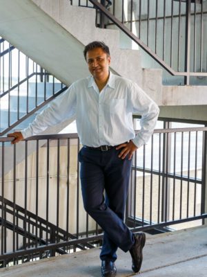 Shabbir Kazmi, AIA<br>ETC's Lead Architect Man drawing tall building design